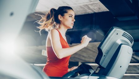 Healthy Woman Running on Treadmill